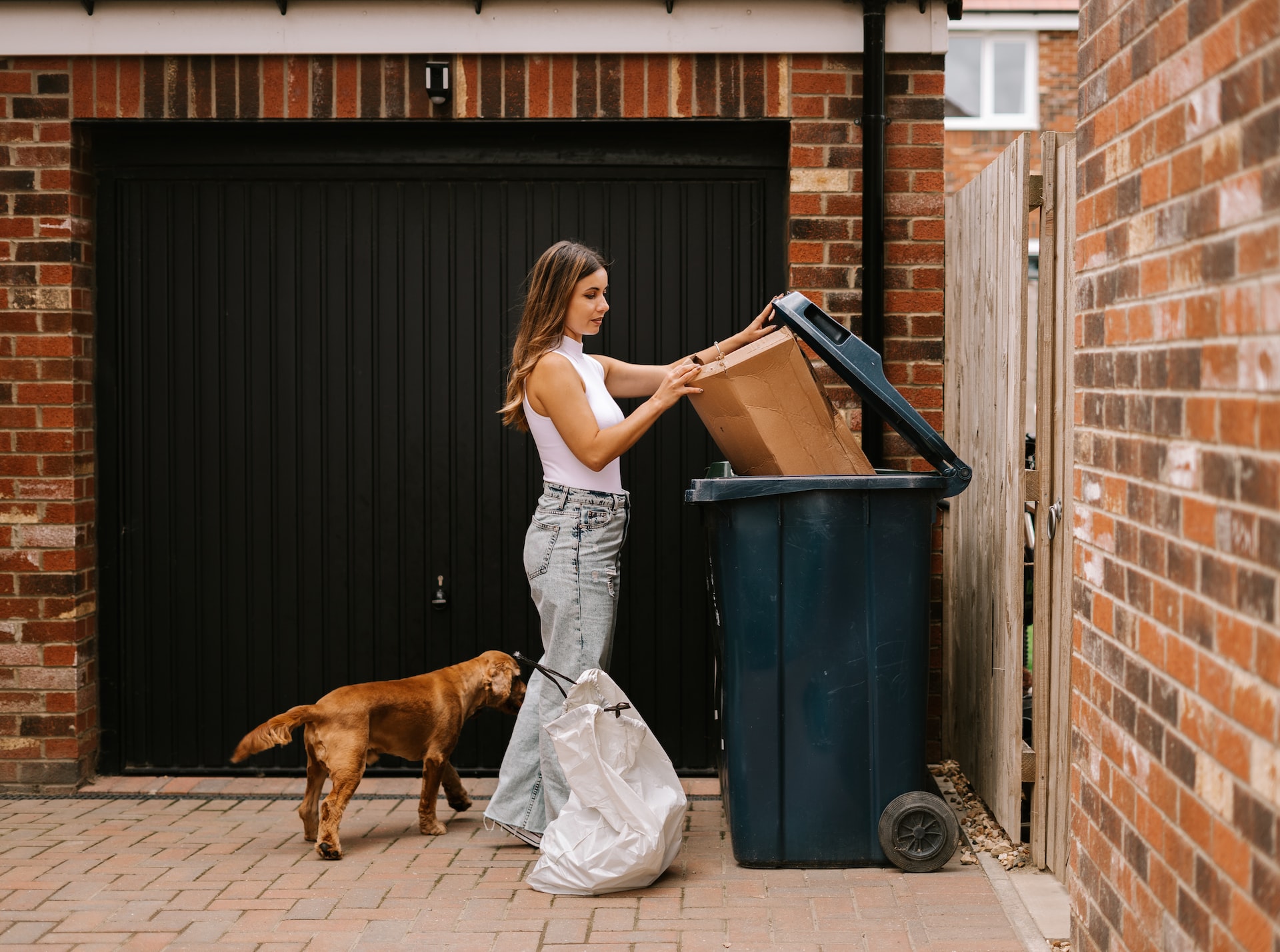 woman using skip bin